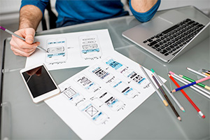 Picture of a man drawing wireframes